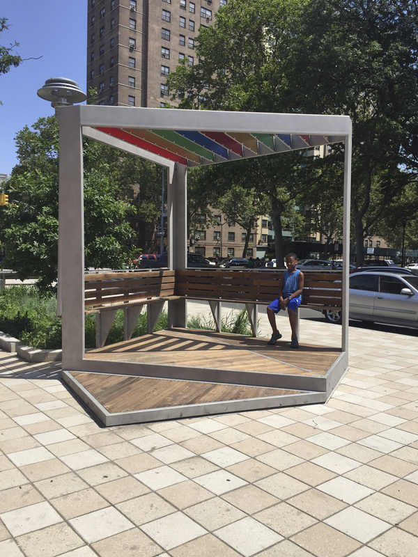 Plaza Perch, with percher Austin Thomas Works Stainless Steel with bead-blasted coating, reclaimed wood decking on the platforms, benches and seat backs, acrylic (3Form) paneled trellis and hardware.