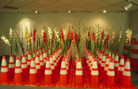 Cindy Tower Viewers as Creators Traffic cones lent by local highway department with gladiola flowers grown by the local  garden club.