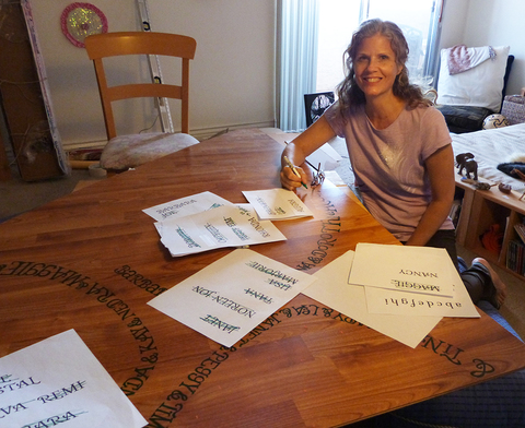 The artist handlettering the honorees' names on the dance floor. Push Down & Tango