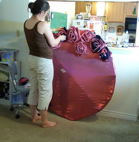 The artist's friend Blair Schweiger helps pin Resiliency Roses to side one of the Rose Cluster. Push Down & Tango