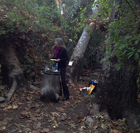 Crystal, the artist, installing paintings Poetry of the Spheres