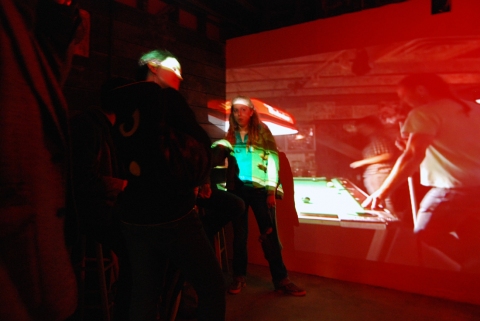 The Last Resort - Installation View, Krowswork Gallery - Oakland, CA Cybele Lyle The Last Resort at Krowswork Gallery Video Projection, Wood Stools, Wood Bar, Mirrored Plexi, Dart Board, Red Light, Beer