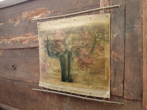 Praising Hydrangea Creatura Botanica: Human and Plant Forms Conjoined Prints fused to grommeted canvas with burnished encaustic hung with twine to plum branches