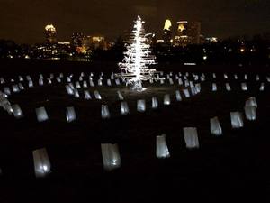 Camille J. Gage Walk of Remembrance luminaria, tree sculpted of wood, LED lights