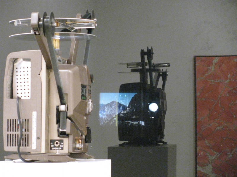 Sundial/Substrate/Scene (Detail) Marc Handelman Geological Sketches at Home and Abroad Glass, oil paint, 16mm projector with looper, color 16mm film (2 min), pedestal and hardware