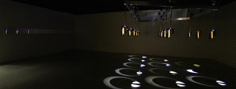 Wappen Field - 12 Helmet Sound Installation Wappen Field: Sculpture & Sound Chrome Plated Steel, Aluminum, Mirrors, LED's, Speaker Drivers, Amplifiers, Computer, SuperCollider, Power Conditioner, Audio 12 Interface