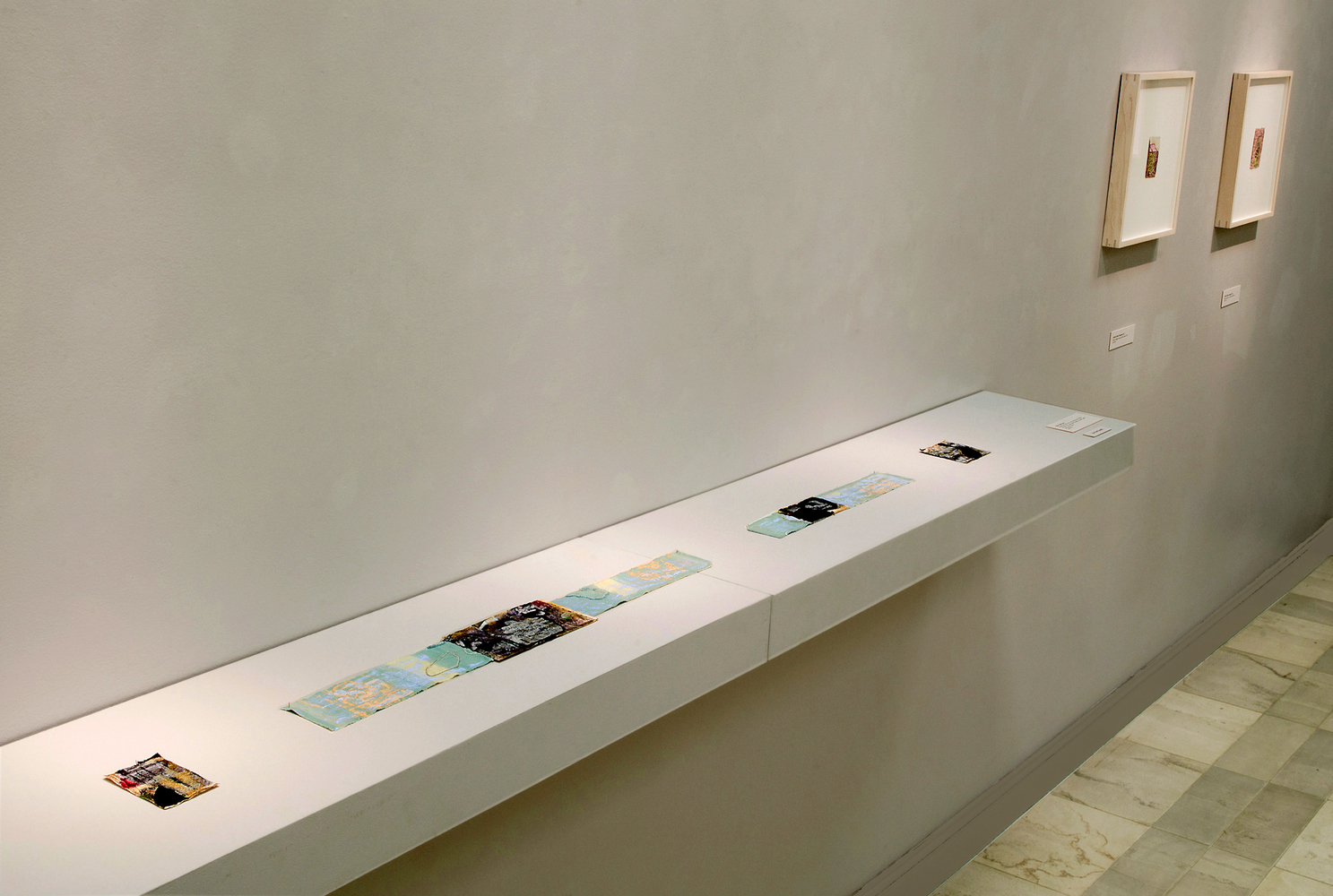 Installation of Blue Tulip Napkin LINE Nicola Ginzel Selected FLATWORK Installations shelf size 8' x 1' x 4" — displayed similar to a scroll