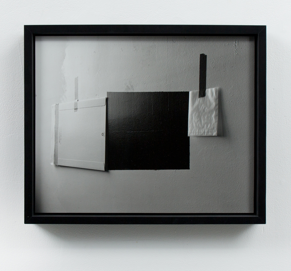 Negative #1 (mailing envelope, black paint, white paint, 4x5 glassine film envelope, red and yellow masking tape) A Room of Her Own Silver gelatin print mounted and framed