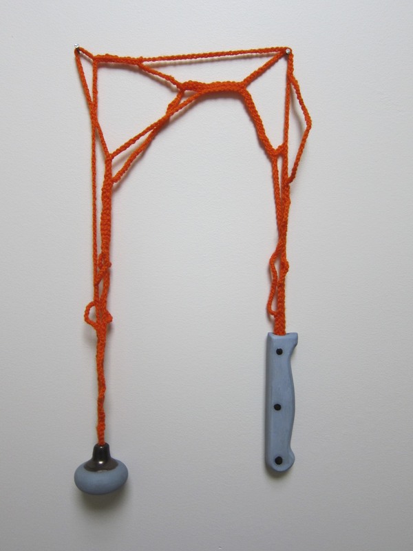 blue and orange hand holding tool Toyls (toys and tools) cermic and wool