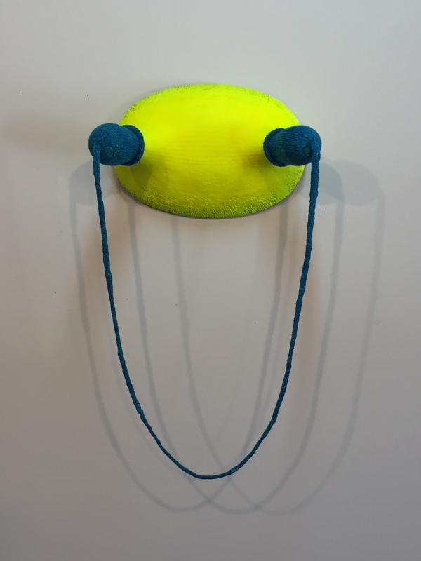 flourescent yellow wearing turquoise sculpture ceramic, fiber, 'plasti-dip'