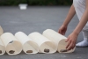  image  stones and approximatley 300 cylindrical sculptures made of ramie cloths and thread