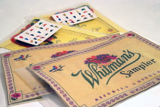 S U N N Y  A.  S M I T H  Whitman's Sampler C-prints, printed aida cloth, cotton embroidery thread, museum board, plastic