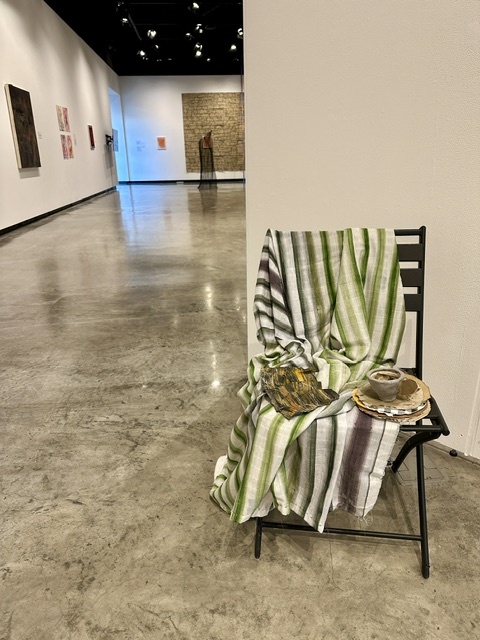 ANN STODDARD Murmurations  Mixed Media: Digitally printed gauze, acrylic paint on handmade paper, airdry clay, cardboard, found papers, found chair