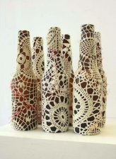 ASHLEY V. BLALOCK UNCATEGORIZED SCULPTURE, 2006 to Pres. beer bottles, doilies and red thread