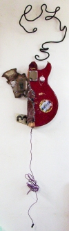  3D / Encaustic / Collage / Assemblage guitar  and scrap car parts, encaustic, pacifier, and various plastic coated wires