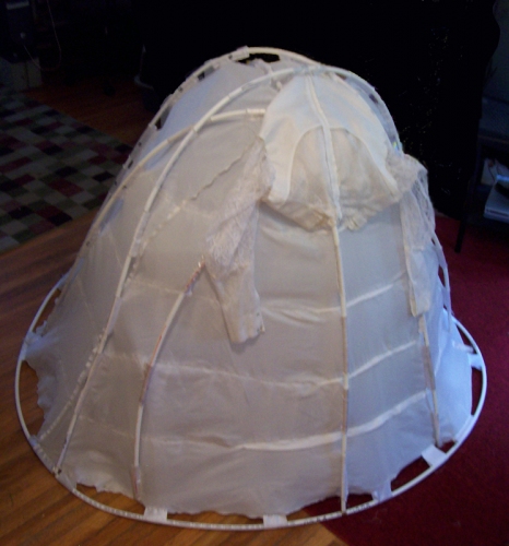 Cindy Tower Happenings/Performed Sculpture 4'x4'x6,, wedding dress and supports, tent stakes