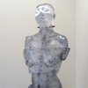  The Human Form Cast glass, powder coated steel base, rubber, wood, iron rod and chain, iron weight, oil paint