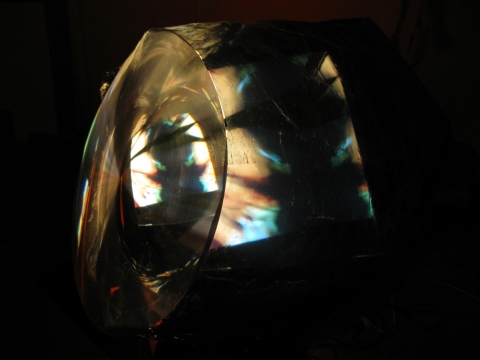 Daniel Healey video sculpture t.v. monitor, stool, mirrors, fresnel lens, mylar, tape, cardboard, light, video