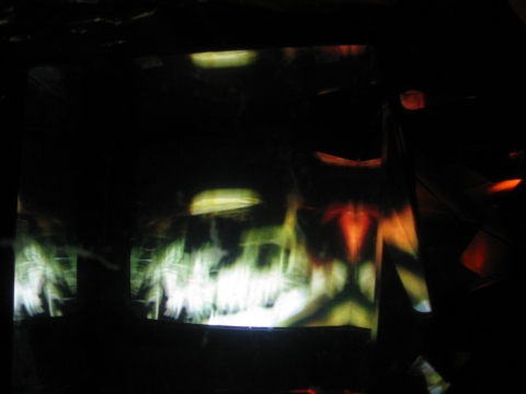Daniel Healey video sculpture t.v. monitor, stool, mirrors, fresnel lens, mylar, tape, cardboard, light, video