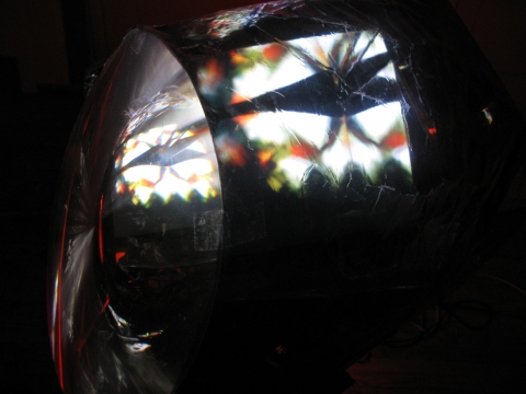Daniel Healey video sculpture t.v. monitor, stool, mirrors, fresnel lens, mylar, tape, cardboard, light, video