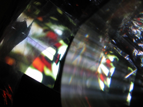 Daniel Healey video sculpture t.v. monitor, stool, mirrors, fresnel lens, mylar, tape, cardboard, light, video