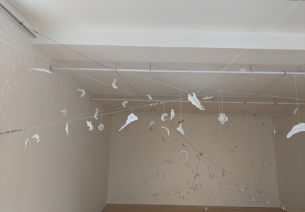 JAN HARRISON Recent Sculpture: Sculptural Installations and Puppets fired porcelain sculptures suspended from cords and cables.