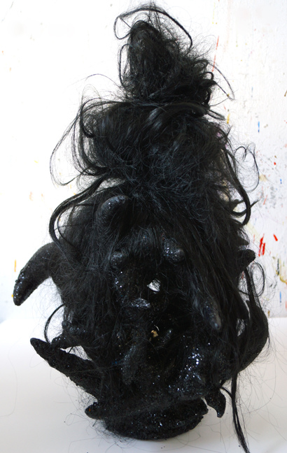 JANICE SLOANE Heads 2007-18 vinyl Halloween masks, plastic bags, steel pins, artificial hair, acrylic paint, glitter