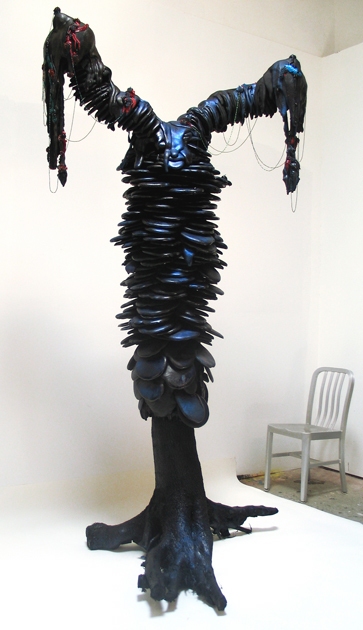  No Reservations  tree trunk, oil paint, urethane foam, glass beads, and pigmented silicone