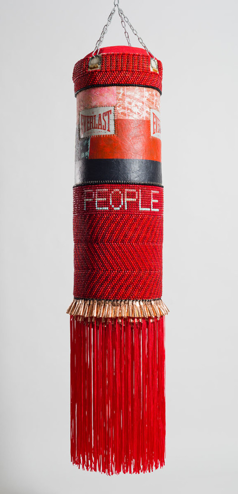  People Like Us Found canvas punching bag, repurposed wool army blanket, glass beads, tin jingles, nylon fringe, artificial sinew, acrylic paint