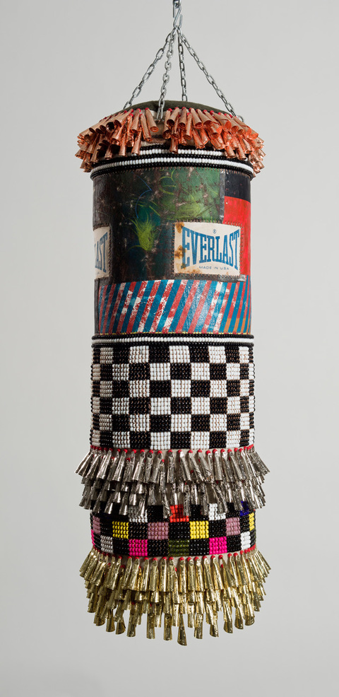  Both Hands  found canvas punching bag, recycled wool blanket, artist’s own repurposed painting, glass beads, artificial sinew, tin jingles, nylon fringe