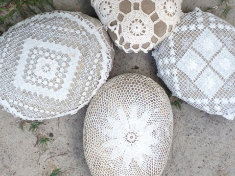  s i t e specific cotton doilies stretched over river rocks