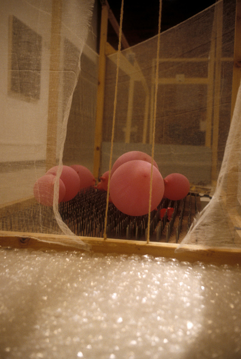 Margaret Keller Passages Series Installation detail, bed of nails, balloons, bubblewrap