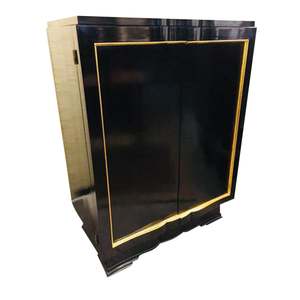 M-B HOME  -  Style Source For The Well Designed Home CHESTS AND CABINETS Black lacquer with gilded trim.