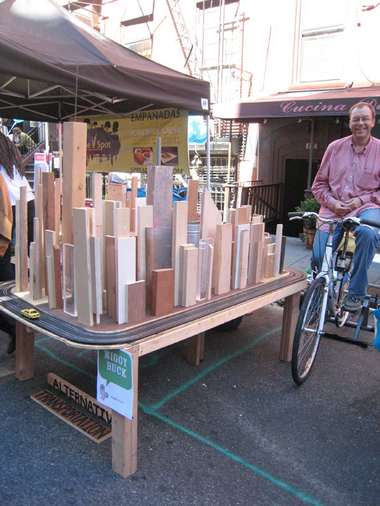 MIGGY BUCK Alternative Transportation Recycled wood, used alternator, toy and bike.