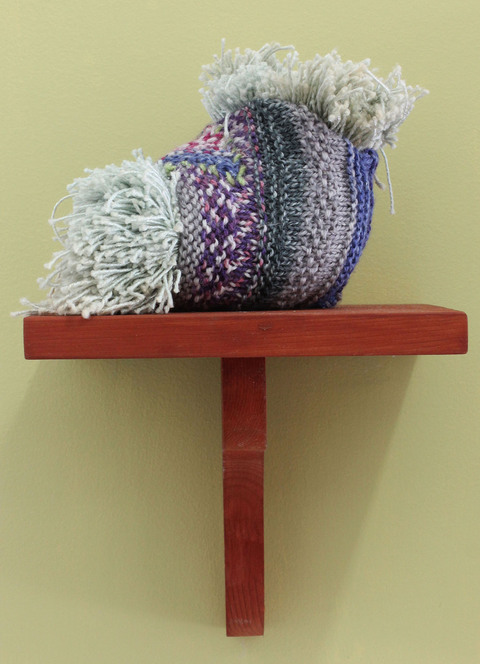 Mollie Murphy How to Make a Severed-Hand Party Tray (sculpture) knitted and stuffed object, wooden shelf, Benjamin Moore's "Pale Avocado" 