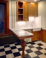 Custom oak cabinets, hand-carved counter pedestal