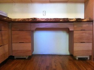 Laundry room storage with live edge countertop (detail)