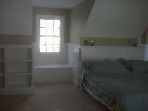 Bedroom makeover - bookcases, window seats with storage, head board with storage