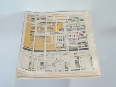 Pat Shannon Tabloids cut newspaper, acrylic gel, wood shelf 