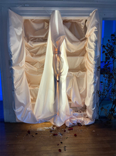 Crash, 2022, shrouded china cabinet, crown, rose petals, and broken glass