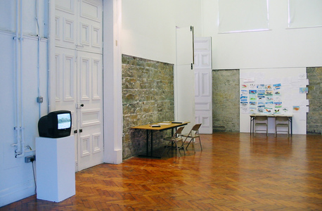 Sarah Iremonger Upside-down Mountains 2003 Wall painting, video, TV monitor, photographs, reproduction prints, photocopied documents, tables, chairs, stencils, pens & paper