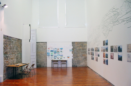Sarah Iremonger Upside-down Mountains 2003 Wall painting, video, TV monitor, photographs, reproduction prints, photocopied documents, tables, chairs, stencils, pens & paper