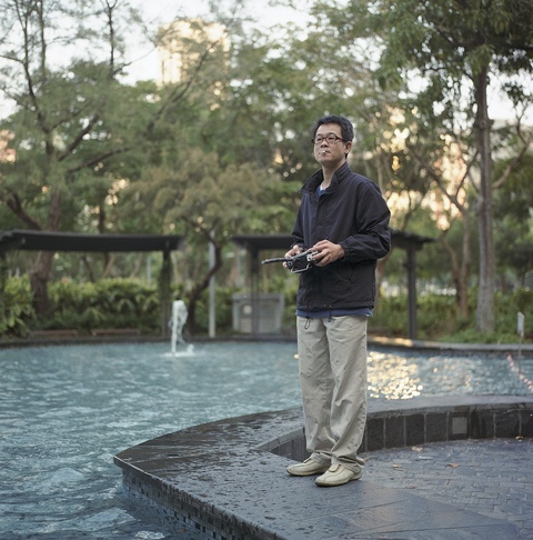Man with Remote Control Boat, Central 