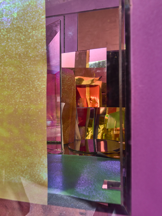  "Within Without in a window" 2021, site-specific installation, Art in Buildings specific installation in vacant NYC storefront window with glass window panes, mylar film, acetate, scotch tape, mirrors, iridescent tape and papers, plexi glass panels