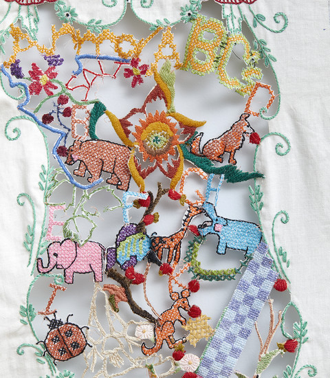 Venetia Dale piecing together collected and stitched together unfinished embroidery