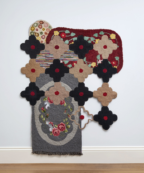 Venetia Dale piecing together collected and stitched together unfinished hooked rugs 