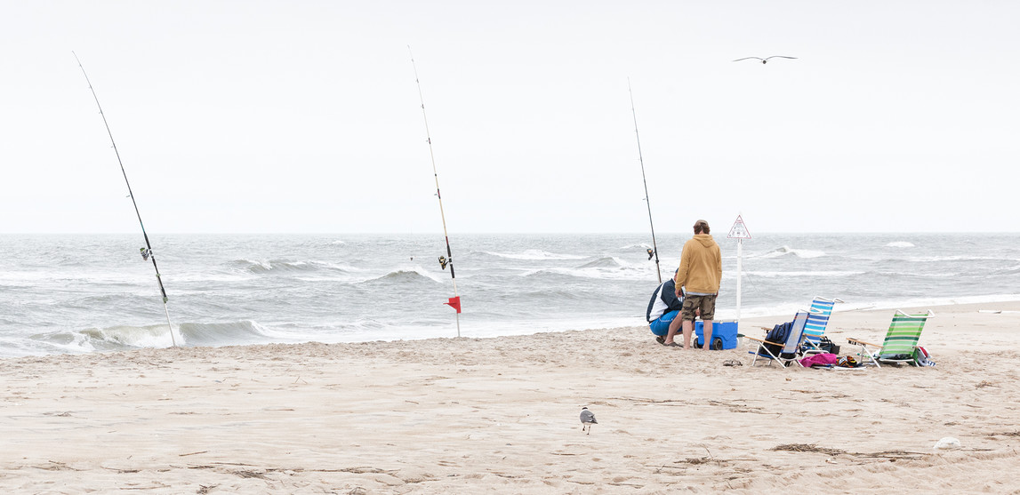 Man In Shorts Walking On Sea Beach In Overcast Day Stock Photo, Picture and  Royalty Free Image. Image 42302040.